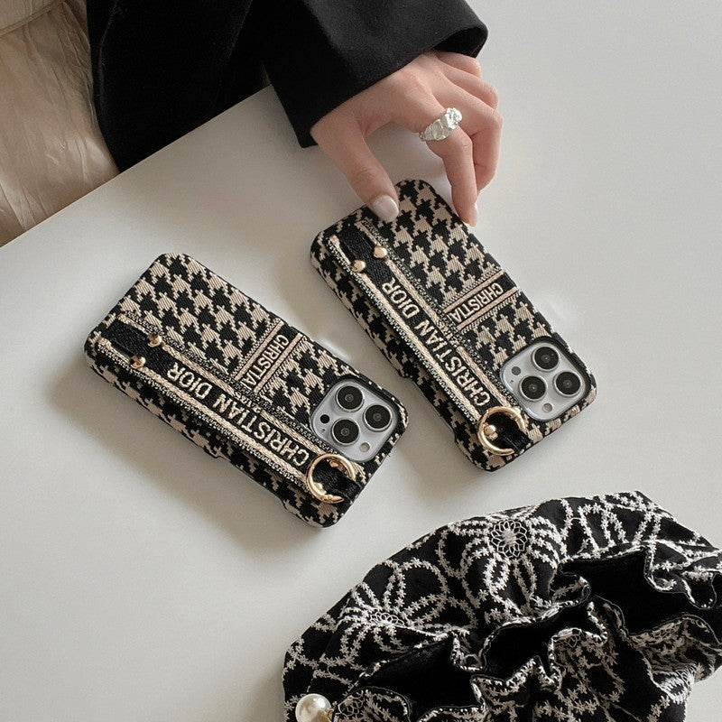 Modefodral för iPhone med Houndstooth-armband